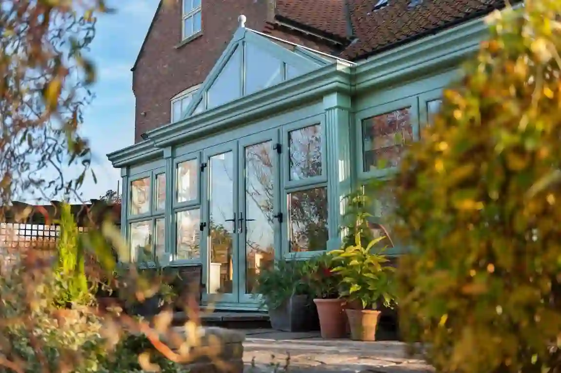 White uPVC French doors opening onto a garden patio