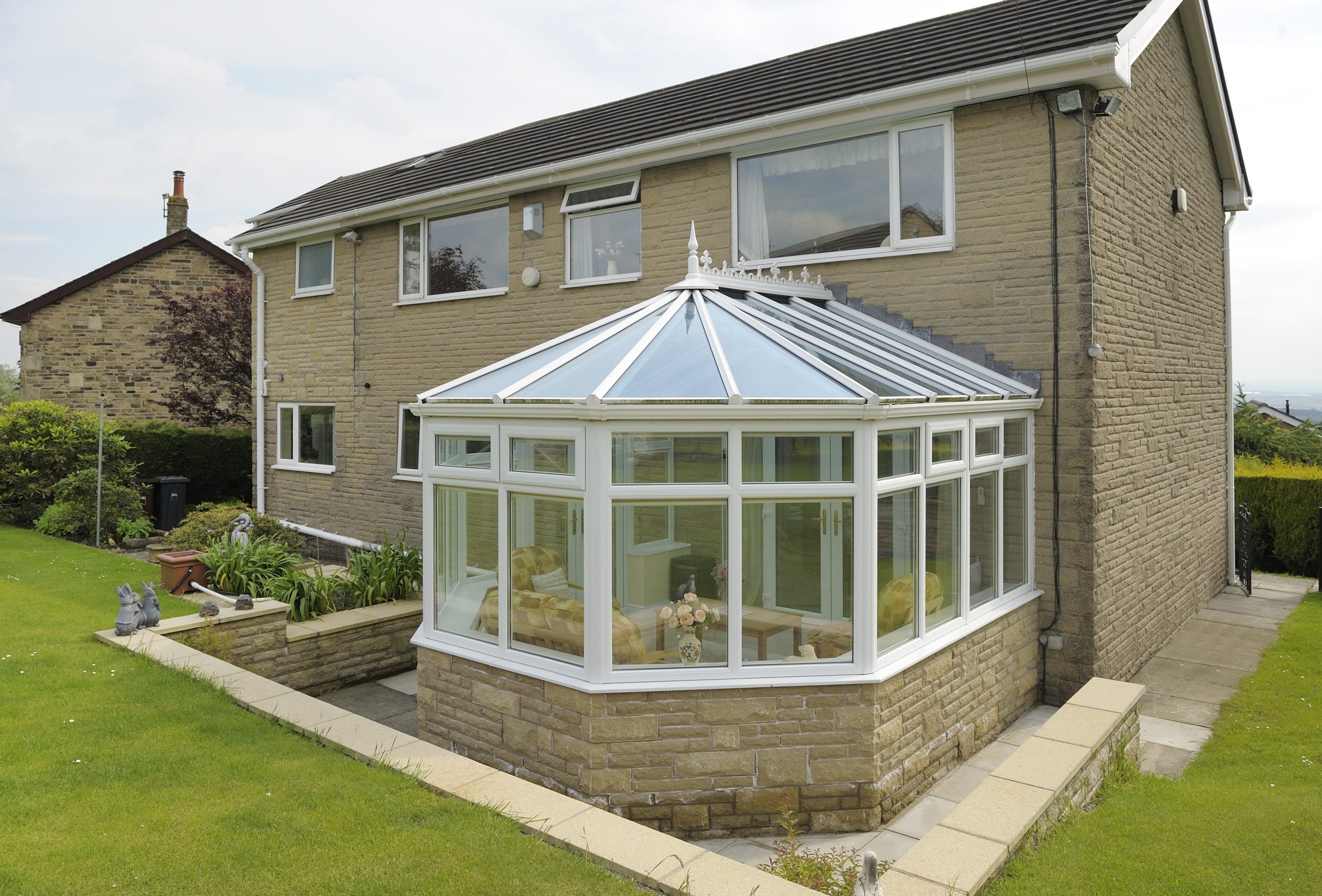 White uPVC Victorian conservatory with a five-bay front, fitted to a Southampton home